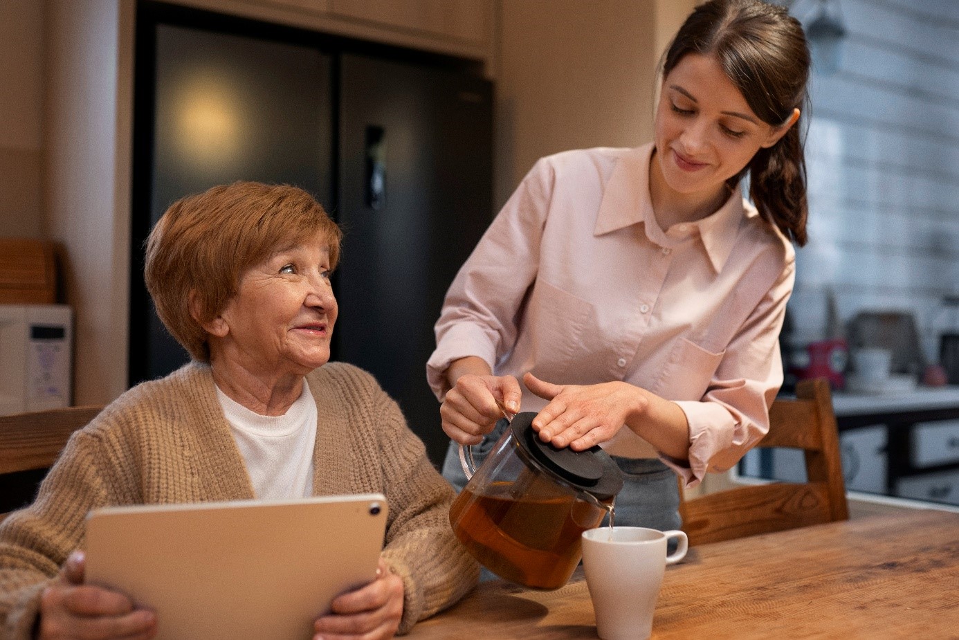 A support worker helping with meal preparation and daily routines